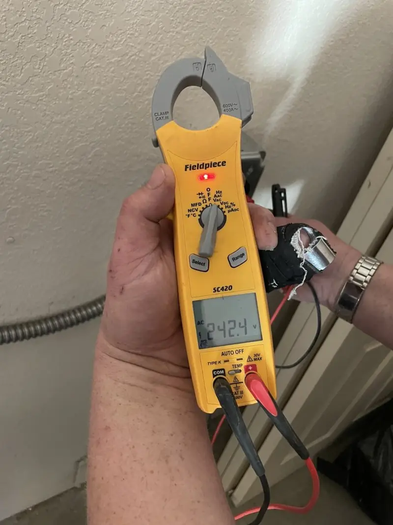 Voltage testing with clamp meter during Outlet Installation in Park Ridge